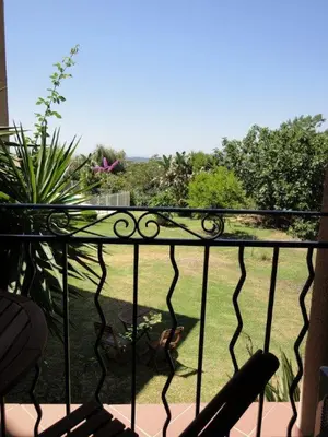 a balcony with a view of a yard at Auberge U Licettu in Cuttoli-Corticchiato