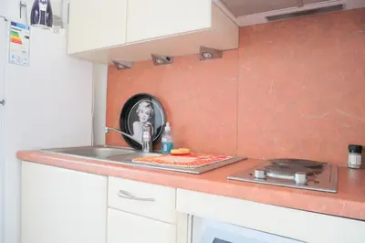 a kitchen with a sink and a counter top at Résidence Tamaris 2 in Porto-Vecchio