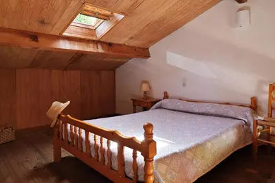 a bedroom with a bed and a skylight at Motel de Porticcio in Porticcio