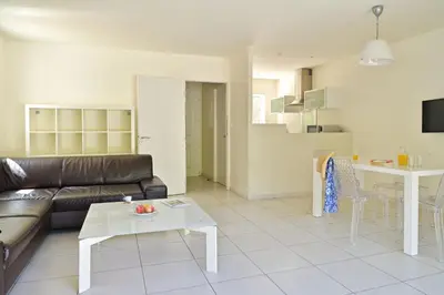 a living room with a couch and a table at Isula Bianca in Porticcio