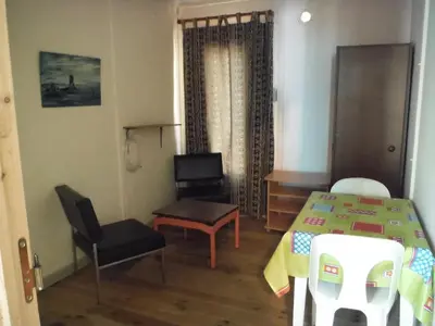 a room with a table and a chair and a table and a table at Camping Europa Beach in Castellare-di-Casinca