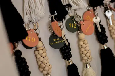 a bunch of beads hanging on a wall at Casa Santini x Roc Seven in Porto-Vecchio