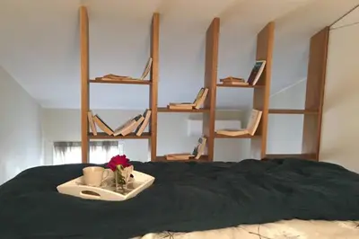 a bed with a tray with a flower on it at U Palazzinu in Porto-Vecchio