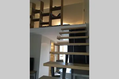 a room with two bunk beds and a table at U Palazzinu in Porto-Vecchio