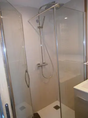 a shower with a glass door in a bathroom at U Palazzinu in Porto-Vecchio