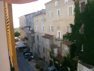a view from a window of a street with buildings at U Palazzinu in Porto-Vecchio