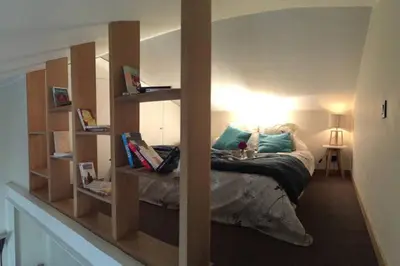a bedroom with a bed with a large mirror at U Palazzinu in Porto-Vecchio