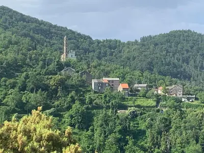 a group of houses on the side of a mountain at Casa Defranchi in Sant Andrea di Bozio