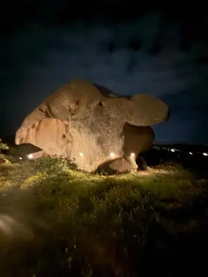 a large rock sitting on top of a field at night at A Santa Trinita in Bonifacio