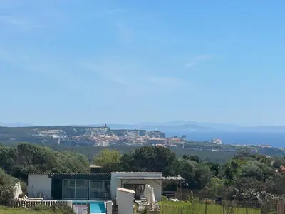 a house on top of a hill with a view at A Santa Trinita in Bonifacio