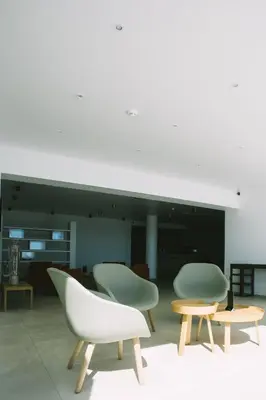 a group of chairs and tables in a room at Hôtel Cala di Sole in Ajaccio