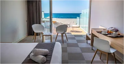 a hotel room with a view of the ocean at Hôtel Cala di Sole in Ajaccio