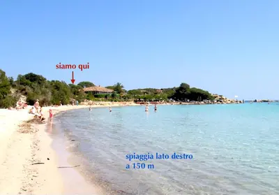 a group of people on a beach in the water at Minivilla Marina di Santa Giulia in Porto-Vecchio