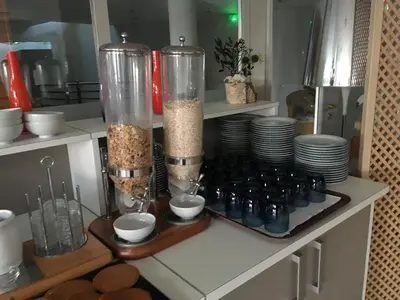 a kitchen with a counter with dishes and a blender at Best Western Plus San Damianu in Sartène