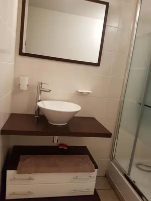a bathroom with a sink and a mirror at Gites San Austinu in Petreto-Bicchisano