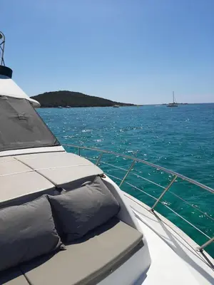 a boat in the water with a view of the ocean at Ocean Yacht Trawler - Le Caloa in Porto-Vecchio