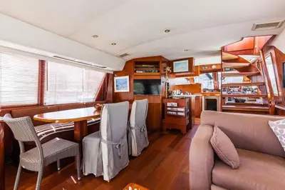a living room with a couch and a table at Ocean Yacht Trawler - Le Caloa in Porto-Vecchio