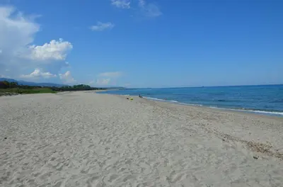 a sandy beach with the ocean in the background at CASA-CORSA chambre d'hote in Cervione