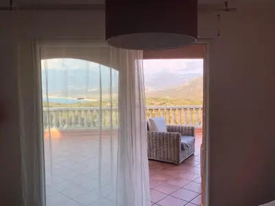 a view of a balcony from a room with a window at Chez Marc et Jeannick in Belvédère