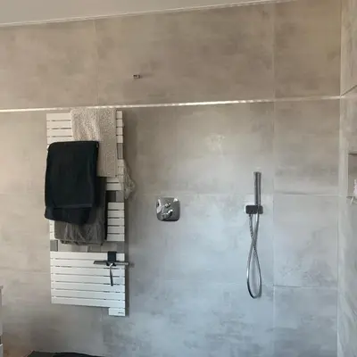 a bathroom with a shower with a towel and a shower at Chez Marc et Jeannick in Belvédère