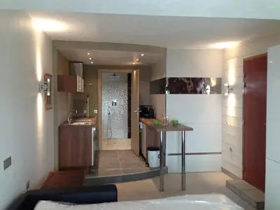 a small kitchen with a tub in a room at VbyOnyx in Olmeto