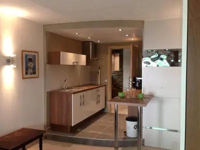 a kitchen with a sink and a refrigerator at VbyOnyx in Olmeto