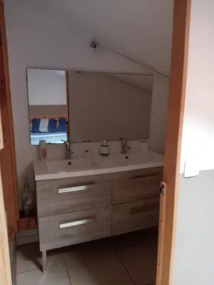 a bathroom with a sink and a large mirror at Berbi Rosse in Oletta