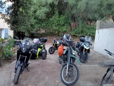 a group of motorcycles parked in a parking lot at Berbi Rosse in Oletta