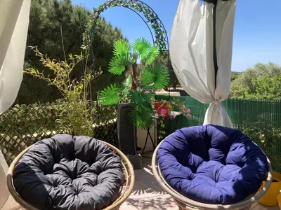 two chairs sitting on at Macchia Évasion avec piscine in Monacia-dʼAullène