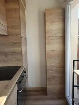 a kitchen with a sink and a microwave at Corsappart in Porto-Vecchio
