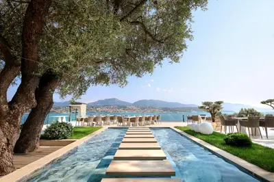 a large commercial kitchen with stainless steel appliances at Hôtel Marinca & Spa in Olmeto
