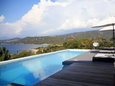 a swimming pool with a view of the water at Dililodge in Verghia