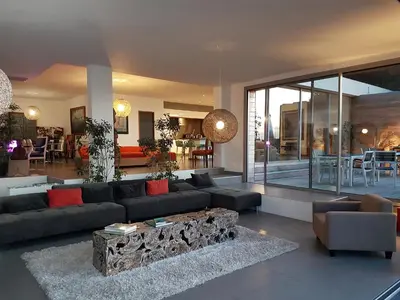 a living room with a couch and a table at Dililodge in Verghia