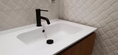 a sink with a faucet in a bathroom at Hôtel Bella Vista in Porto Ota