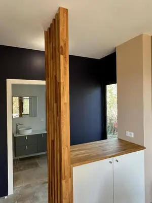 a bathroom with a counter with a sink and a mirror at Villa Libecciu in Sainte-Lucie de Porto-Vecchio
