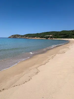 a sandy beach with the ocean in the background at A Stalla in Piana