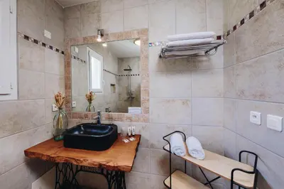 a bathroom with a sink and a mirror at B&B A Chjusellina in Corte