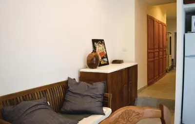 a living room with a couch with pillows on it at Beautiful Apartment In Sollacaro in Sollacaro