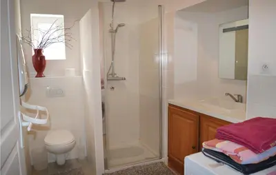 a bathroom with a shower and a toilet and a sink at Beautiful Apartment In Sollacaro in Sollacaro