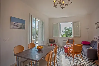 a living room with a table and chairs at Villa Kalliste in Porto Ota