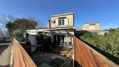 a view of a house from a balcony at Appartement Maenat in Borgo