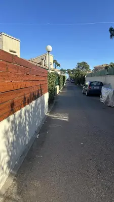 a fence on the side of a street at Appartement Maenat in Borgo