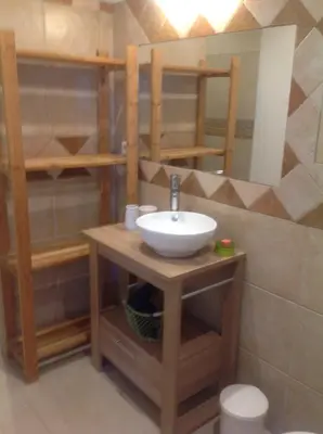 a bathroom with a sink and a mirror at Apartement Alba Oletta in Oletta