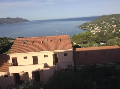 a building with a view of the water at Panoramic Seaview studio Tiuccia in Casaglione