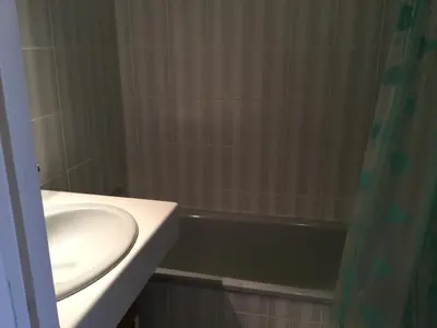 a bathroom with a sink and a bath tub at Les Marines de Morian in Moriani Plage
