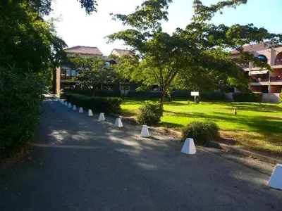 a row of white cones in the middle of a road at Les Marines de Morian in Moriani Plage