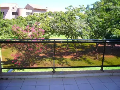a view of a garden from a window with trees at Les Marines de Morian in Moriani Plage