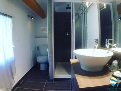 a bathroom with a sink and a shower and a toilet at A Casa di Mariano in Alata