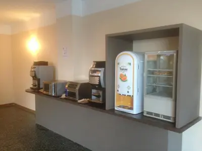 a counter with a refrigerator in a room at Capo D'orto - Porto - Corse in Porto Ota