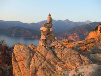 a stack of rocks on top of a mountain at Capo D'orto - Porto - Corse in Porto Ota